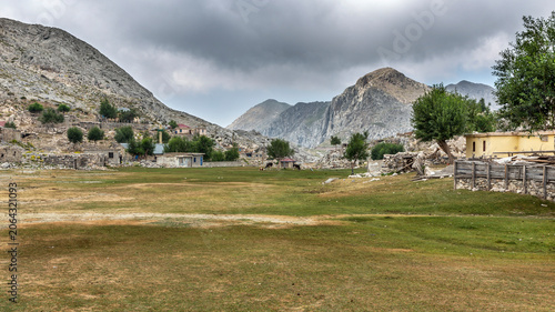 Obraz na plátne Authentic stone huts and free-range chickens in a traditional Turkish highland p
