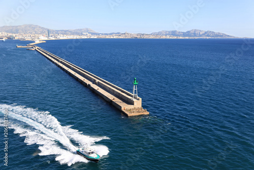 Pilot boat passing the breakwater at Marseilles France