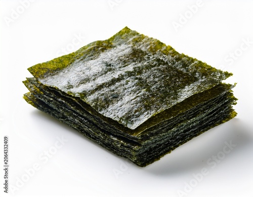 stack of dried seaweed nori sheets with glossy green texture isolated on white background