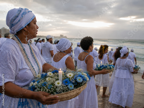 Umbanda and candomblé followers honoring iemanjá on brazilian beach