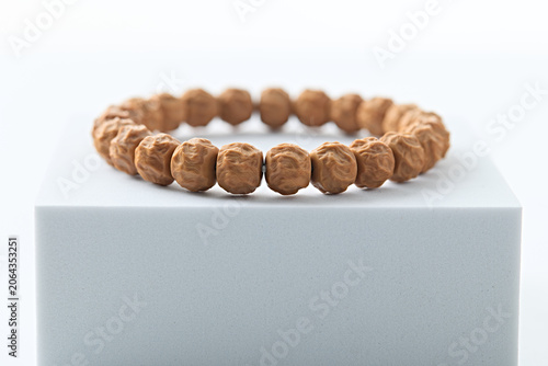 Smooth Polished Barrel Bead Natural Wrist Bracelet on White Minimalist Display Platform