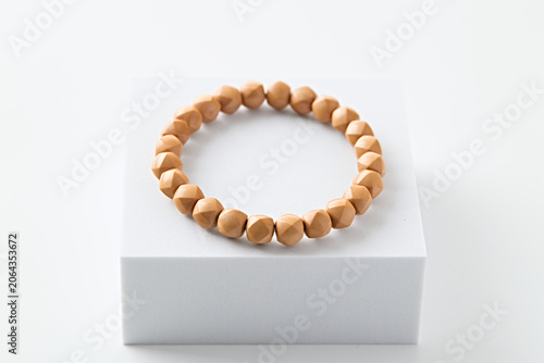 Smooth Polished Barrel Bead Natural Wrist Bracelet on White Minimalist Display Platform
