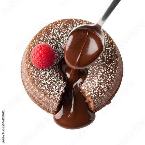 Molten chocolate lava cake with a scoop of flowing chocolate sauce and fresh raspberry, dusted with powdered sugar, top view.
