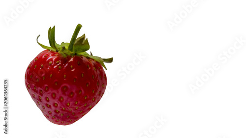 Fényképezés One whole ripe strawberry with green stem on isolated white background