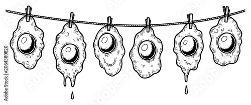 Tableau sur toile Fried eggs hanging on clothesline with pins in quirky surreal ink style