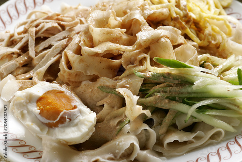 Slika na platnu Cold Noodles with Shredded Chicken, Cucumber, and Salted Egg