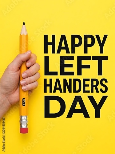 Hand holding pencil celebrating Left Handers Day on yellow background with text