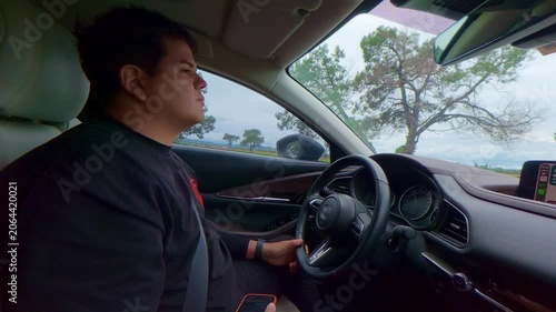 Man driving on a scenic road trip