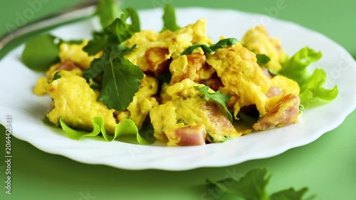 egg dish with arugula on green background