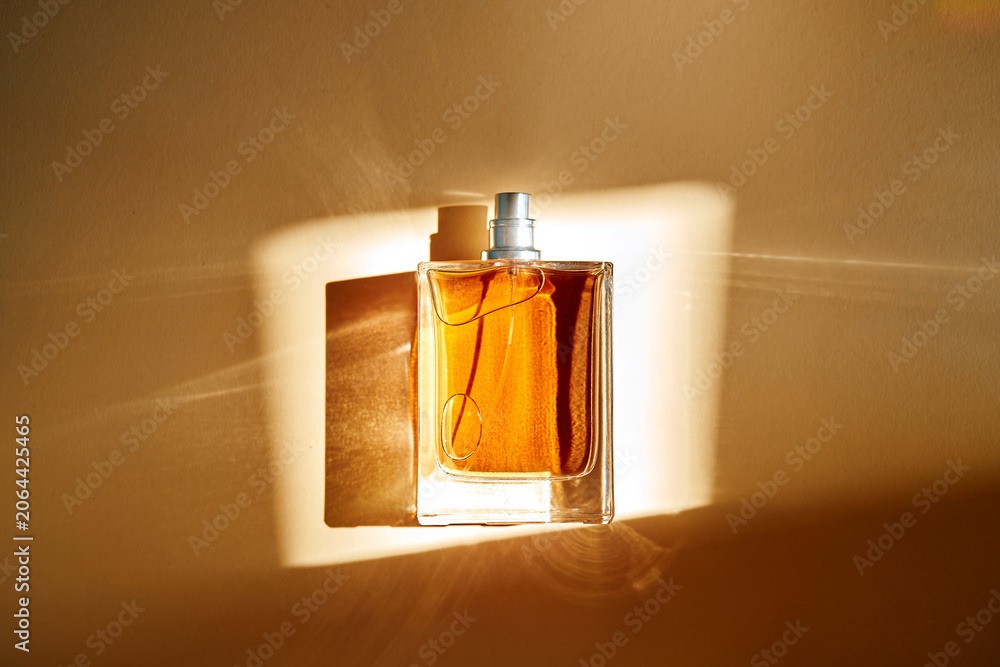 Fototapeta premium Biotech perfume bottle in warm natural light
