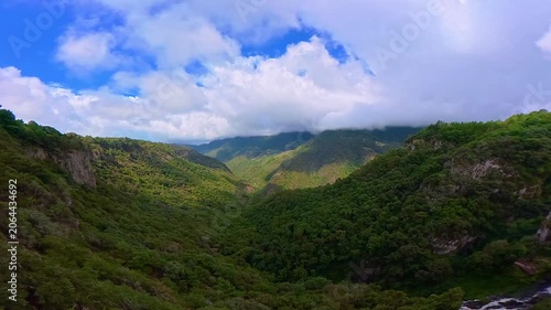 Scenic valley with moving clouds over las brisas waterfall