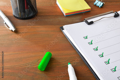 Checklist on Clipboard with Green Check Marks