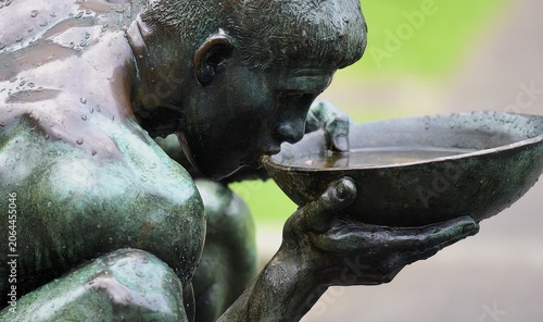 Canvas Print Bronze sculpture titled  Mann som drikker by the Norwegian sculptor Per Palle Storm at the Crown Princess Martha's Square Garden in Oslo, Norway