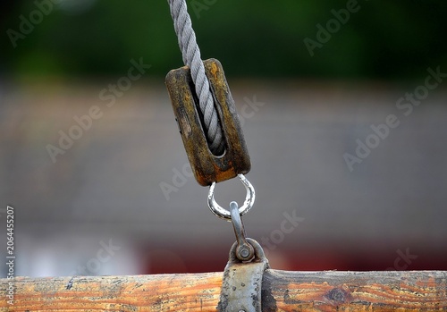 Photography Antique wooden fishing boat pulley on Akershusstrandaat at the Oslo Havn in Norway