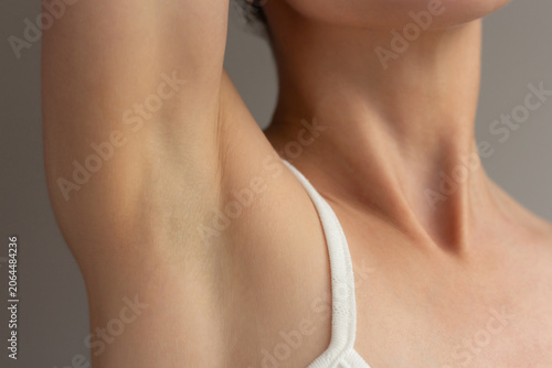 Obraz na plátně Close-up of young woman showing clean smooth and healthy armpit skin
