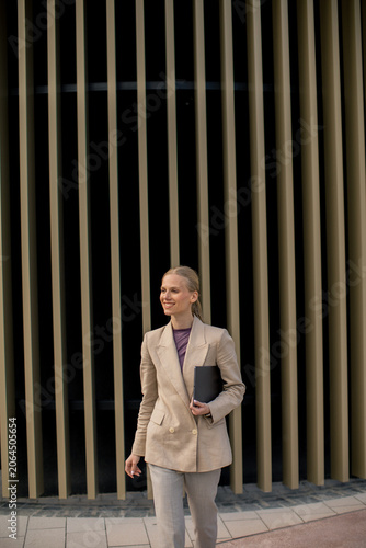 Businesswoman walks confide...