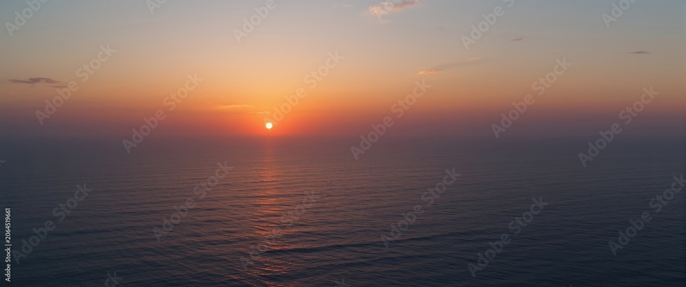 Obraz premium Ocean landscape at sunset from above with expansive open space and copy space area
