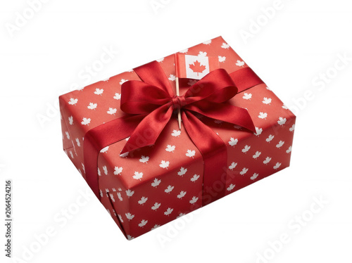 Red gift box with white hearts and a big silk ribbon bow isolated on transparent background