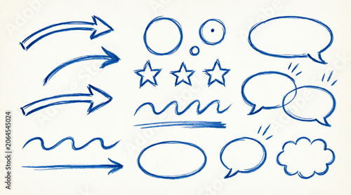 Set of various hand-drawn blue doodle vector elements on light paper background.