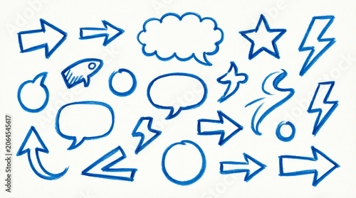 Blue marker drawn icons and symbols on white paper background.