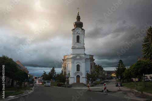 Church of the Nativity of the Virgin Mary in Trsice, Czech Republic. Neo-Baroque church against a stormy sky