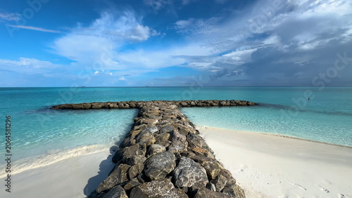 Photos Stone breakwater of Maldives tropical paradise islands
in Indian Ocean