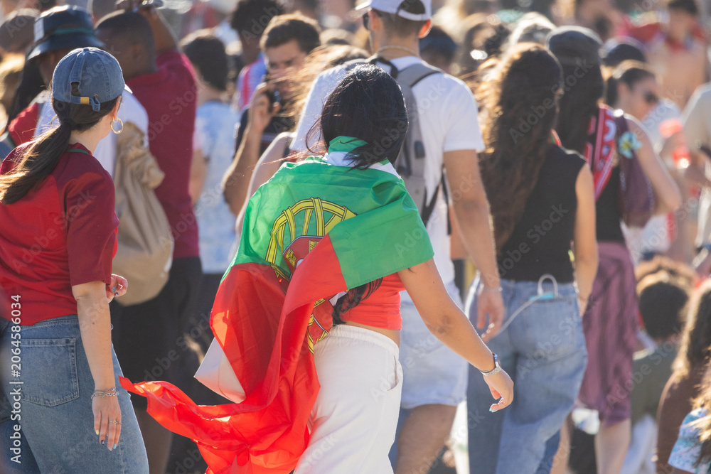 Naklejka premium Woman wearing portugal flag during football celebration rally