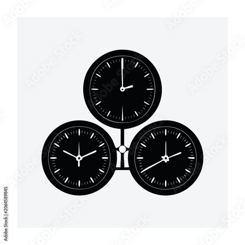 Three black clocks in symmetrical arrangement