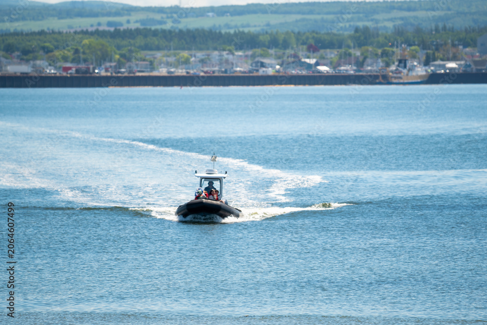 Fototapeta premium Motorboat Crossing the St. Lawrence River Near Rimouski, Quebec