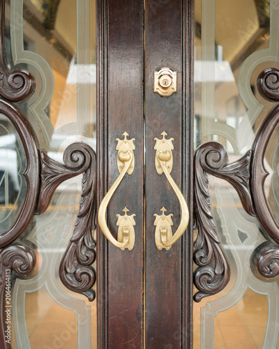 Elegant Vintage Wooden Door with Brass Handles