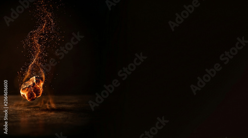 Burning glowing stone with fire sparks