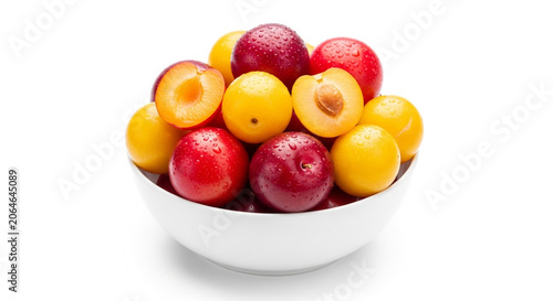 Fresh fruit bowl with red and yellow plums
