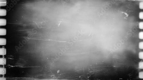 Fotografie Vintage film strip shows grainy, faded black white image