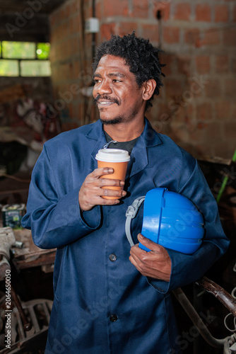 African worker having a coffee break