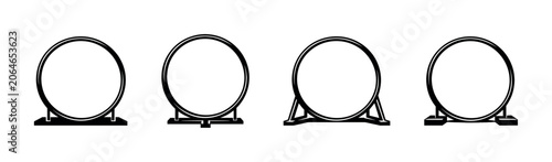 Photos Collection of four different dog agility jump hoops with varied bases