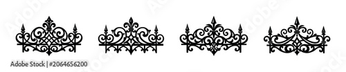 Konstfotografi Collection of ornate black wrought iron fence elements with decorative scrolls a