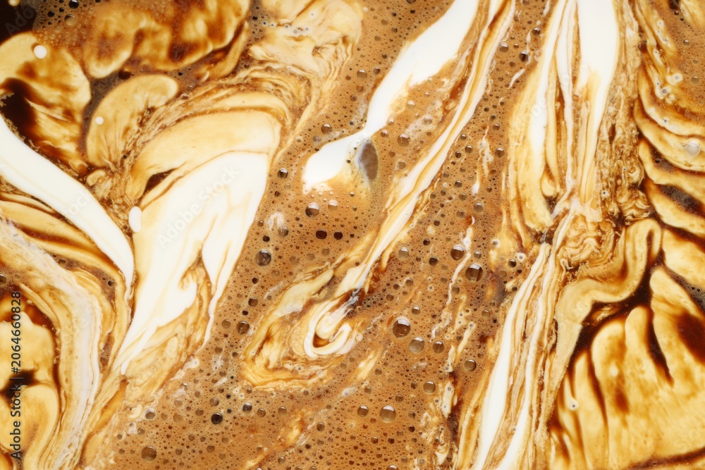 Obraz premium Delicious coffee with milk and bubbles as background, top view