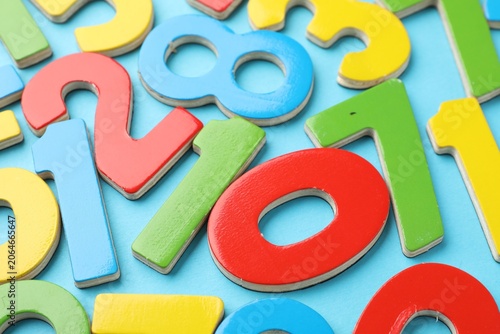 Canvastavla Colorful numbers on light blue background, closeup