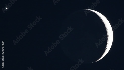 Astronomy telescope video of celestial conjunction with crescent moon ashen light and Venus