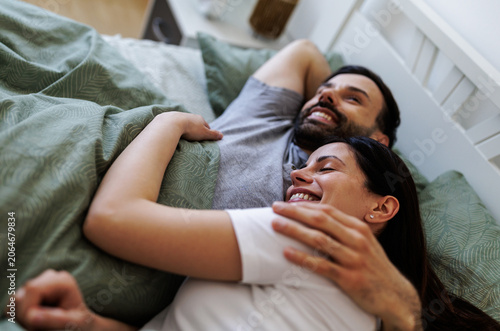 Couple enjoys time together in bed