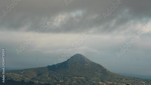 Overcast sky with clouds moving over teoton hill in puebla