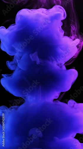 Vibrant purple and blue ink explosion in water