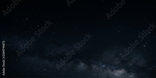 Fotografie Cosmic Canvas: The Milky Way galaxy stretches across a dark night sky, dotted with countless stars, evoking a sense of wonder and the vastness of the universe