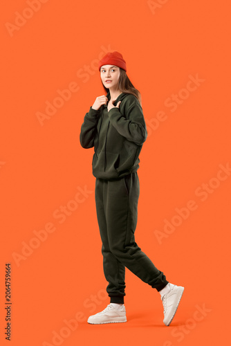 Young woman in sports suit ...