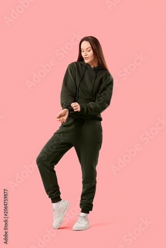 Young woman in sports suit ...