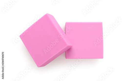 Pink rubber erasers on whit...