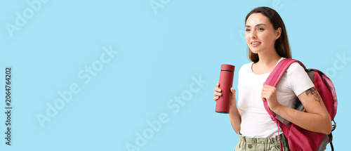Female tourist with thermos...