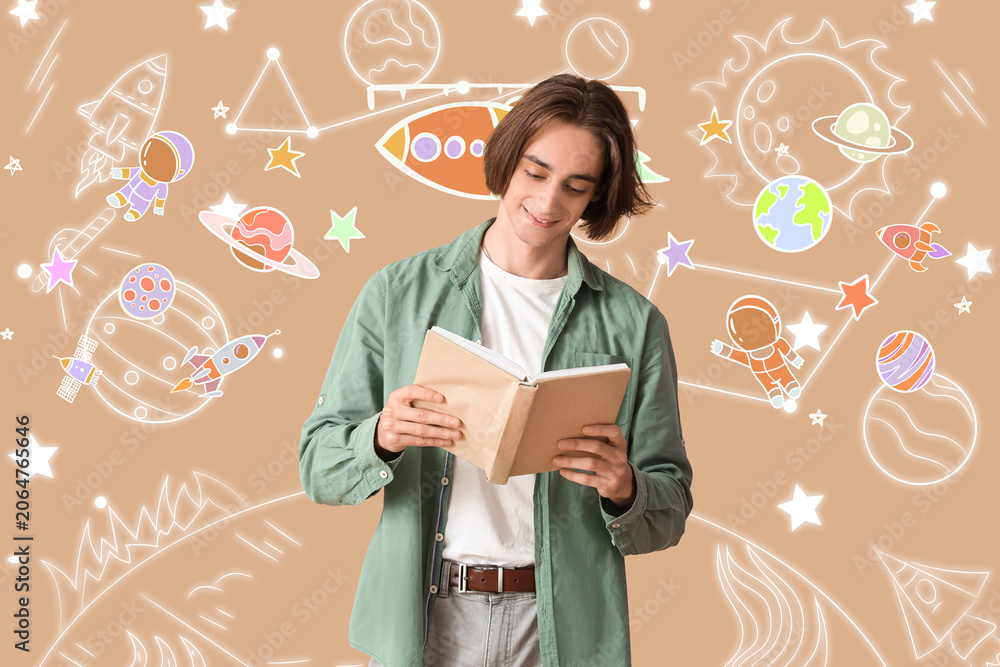 Fototapeta premium Young man reading book on beige background