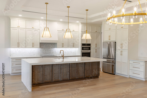 Photos Perspective view of luxury modern kitchen featuring a large central island with