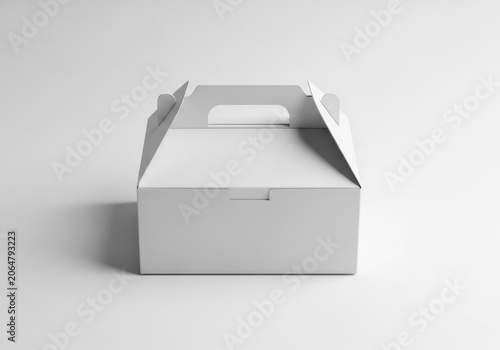 Blank white cardboard cake box with handle isolated on white background